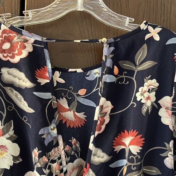 One❤️Clothing navy blue floral long sleeved romper. Size XS. Open V in the back. - Picture 11 of 14